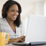 African American woman using laptop