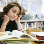 High School Student Studying in Library